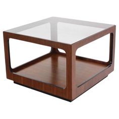 a wooden and glass coffee table on white background