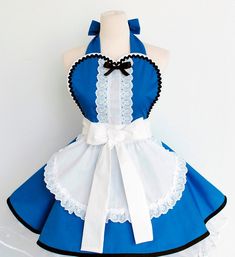 the apron is blue and white with black laces on it's waistline