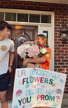 a man and woman standing in front of a door with flowers on the sign that says, ur obesed w flowers are observed by you from?