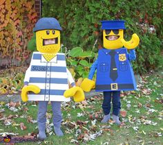 two people in lego costumes holding hands