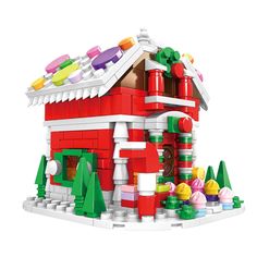 a toy house made out of legos on a white background