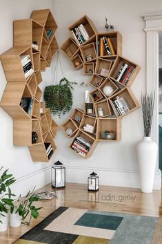 a living room with bookshelves on the wall and a potted plant in the corner