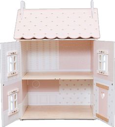 a doll house with pink walls and white trimmings on the windows, doors, and shelves