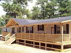 a mobile home with porch and covered deck