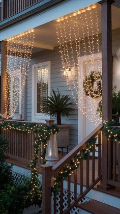 the front porch is decorated with christmas lights