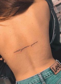 the back of a woman's stomach has an inscription that reads, i love you