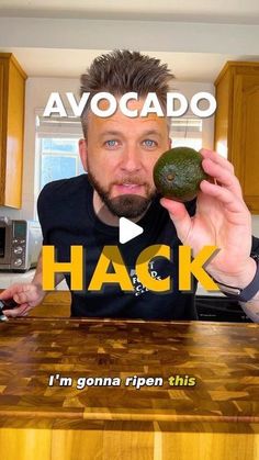 a man holding an avocado in front of his face with the words hack above him