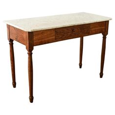 an old wooden table with marble top and legs on the bottom, against a white background