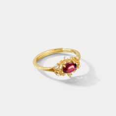 Crafted with intricate detail, this shining Garnet Vintage Ring will bring an air of elegance and sophistication to any outfit. Perfect for formal occasions and everyday use, its timeless, vintage design makes it a staple item to keep in your jewelry collection, and its versatile nature works equally well for a night out or a dinner party. Now truly own the moment and shine with the Garnet Vintage Ring. DETAILS Plating:  9 K Gold  Materials:  9 K Gold on Silver, Natural Mozambique Garnet, Cubic Classic Garnet Rings With Intricate Design, Gold Garnet Ring Vintage, Garnet Vintage Ring, Vintage Oval Garnet Jewelry, Vintage Garnet Rings With Polished Finish, Victorian Garnet Gemstone Rings, Garnet Ring Vintage, Star And Moon Necklace, Rabbit Earrings