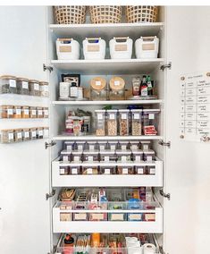 an organized pantry with white shelving and lots of food in baskets on the shelves