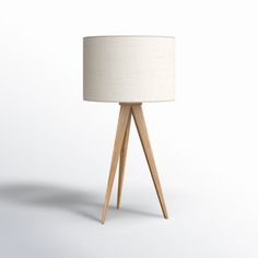 Lightweight, portable, and mindful of space, this tripod table lamp keeps any surface looking bright. It features a wooden base with three flared, tapered legs that come in a natural brown tone for a Scandi vibe. Topped off with a white textured linen drum shade, it helpfully diffuses the glow from a 100W max bulb, which is sold separately and controlled by a helpful 3-way switch. At about 26" tall and just under 14" wide, it's just the right accent for your entryway console or end table. AllMod Tripod Table Lamp, Tripod Floor Lamp, Tripod Table, Entryway Console, Brown Tone, Tripod Floor Lamps, Tripod Lamp, The Glow, Wooden Base