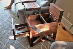 a living room area with a couch, chair and coffee table in the middle of it