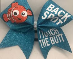 "Cheer Bow Back Spot I touch the BUTT GORGEOUS turquoise glitter (or any color on chart) by blingitoncheerbowz This listing is for a new, handmade (by me) cheer bow. It is on a thick black hair tie and is a BIG bow made on 3\" grosgrain ribbon. Measures about 7 1/2 inches across. Gorgeous My bows are professionally made with a heat press in my bow studio, NOT a hand iron, and I guarantee all bows for the current season. Even if a hair tie breaks, send it back to me and I will fix or replace it. Cheer Bow Designs, Cheer Gifts Diy, Competition Cheer Bows, Cheer Locker Decorations, Disney Cheer Bows, Cheer Accessories, Thick Black Hair, Black Hair Tie, Cute Cheer Bows