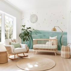 a baby's room with a crib, rocking chair and large potted plant