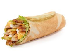 a burrito filled with meat, lettuce and other toppings on a white background