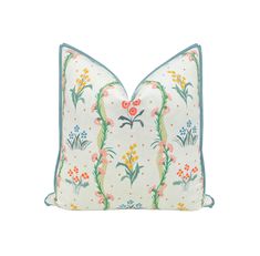 a white pillow with colorful flowers on it