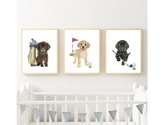 three dogs are hanging on the wall next to a baby's crib, and one is holding a golf ball