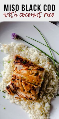 a white plate topped with rice and chicken