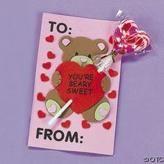 valentine's day card with two lollipops and a teddy bear