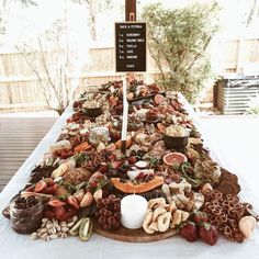 a table topped with lots of food and a sign that says, i love you