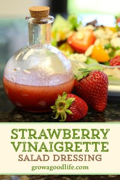 strawberry vinaigrette salad dressing in a glass bottle with strawberries on the side