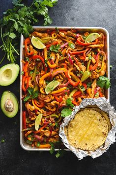 a dish with chicken, peppers and avocado next to some cut up cilantro