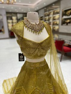 Elevate your bridal look with our Metallic Yellow Bridal Lehenga BL-121! The stunning metallic yellow color, beautifully complemented by intricate foil work, will make you stand out on your special day. Make a bold statement and feel like a princess with this breathtaking lehenga! Fabric: Net with Raw Silk Lining! WASH CARE INSTRUCTIONS - Please Dry clean only when it is applicable! Ready to Ship! Gold Floor-length Anarkali Set With Cutdana, Festival Gold Sharara With Gold Embroidery, Pista Green Wedding Sets With Unstitched Blouse, Pista Green Wedding Set With Unstitched Blouse, Gold Embroidered Sharara For Festivals, Gold Sharara With Gold Embroidery For Festivals, Pista Green Anarkali Set With Unstitched Blouse For Wedding, Wedding Set With Unstitched Pista Green Blouse, Gold Dupatta For Reception And Festivals