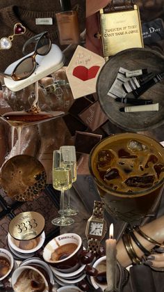 a table topped with lots of different types of food and drink items next to each other