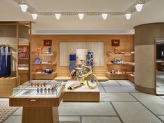 a bike is on display in a store with wooden walls and shelves filled with items