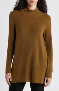 A simply styled long-sleeve tunic knit from soft, breathable wool yarn is a versatile staple that can be dressed up or down. 30" length Mock neck Long sleeves 100% wool Hand wash, dry flat Imported Tunic Sweater, Long Sleeve Tunic, Wool Yarn, Eileen Fisher, Gold Leaf, Mock Neck, Dress Up, Hand Wash, Nordstrom