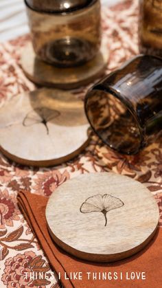 the table is covered with glass and wood coasters