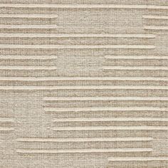 an upholstered beige and white rug with horizontal stripes on it, in the middle of