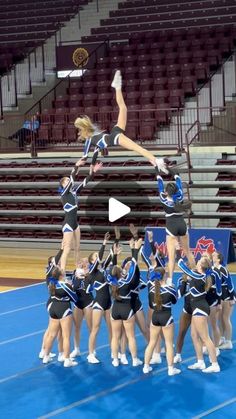 the cheerleaders are doing tricks on the court