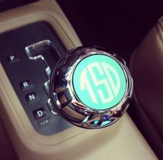 an automatic gear stick with the letter g on it's center console in a car