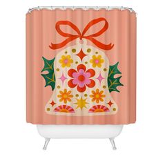 a shower curtain with a bell decorated with flowers and holly leaves on an orange background