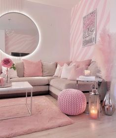 a living room filled with furniture and a round mirror