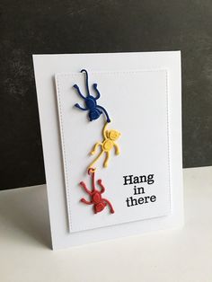 a handmade card with two monkeys hanging from it's sides and the words hang in there