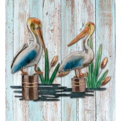 Set a calming mood with this three-dimensional piece that features a duo of pelicans in classic poses with dock and reeds framing the scene. Hand-painted in metallic colors. 3-D presence on wall. Weather & fade resistant paint. High gloss finish. Reflective Wall, Tin Walls, Outdoor Wall Art, Outdoor Light, Blue Heron, Wall Sculpture Art, Metal Sculpture, Metallic Colors, Online Art Store