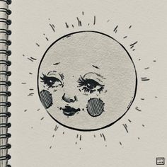 a drawing of the moon with eyes drawn on it