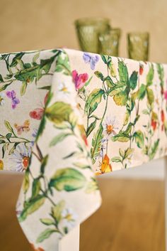 the table cloth is covered with colorful flowers