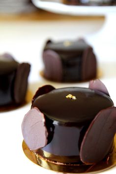 several pieces of chocolate cake sitting on top of each other