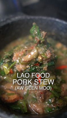 a close up of food in a pan on a stove with the words lao food pork stew