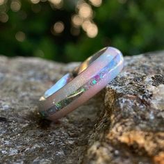 Stunning 6mm wide DiamondCast™ Unicorn poop with opal inlay. This wedding band is custom-made for you right here in the USA by skilled artisans who have an uncompromising passion for quality and style. The finish on this ring is polished with a rounded profile. *6mm DiamondCast™ Unicorn Poop with opal inlay *Available in sizes 4-15.5 in whole, half, and quarter size increments *Handcrafted by Skilled Artisans SKU: COB-6F-DC UP-11.5G-PURP OPAL About DiamondCast: DiamondCast™ Blanks are made with