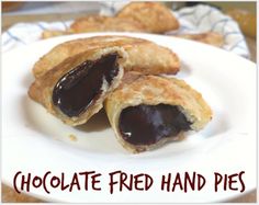 chocolate - fried hand pies on a white plate with the words, chocolate - fried hand pies