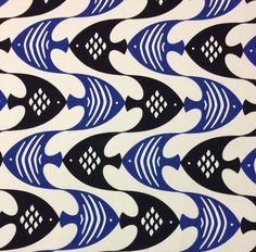 blue and black fish on white paper with squares in the middle, as if it were an ornament