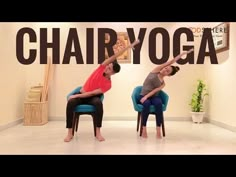 two people sitting in chairs doing yoga poses