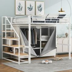 a white loft bed with stairs leading up to it