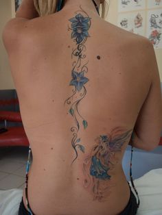 a woman with a tattoo on her back