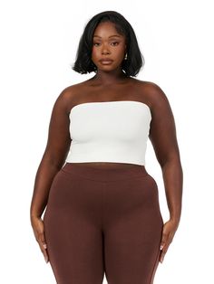 Our versatile tube top hugs your body and can be worn long or folded under for a more cropped look. Style this with our matching bottoms, our cargo pants, our denim jeans and more. Legacy Collection Import 95% Viscose, 5% Spandex Model wears size 1X True to size Double-lined Plus Size Tube Top Outfit, Plus Size Tube Top, Hug You, Tube Top, Cargo Pants, Denim Jeans, Crop Top, Sleeve Length, Spandex