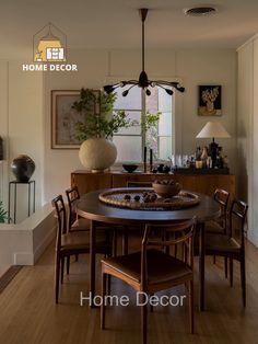 a dining room table and chairs in front of a window with the words home decor above it